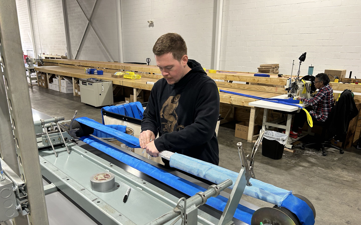 J.A. Lifting Products employee fabricating a round sling