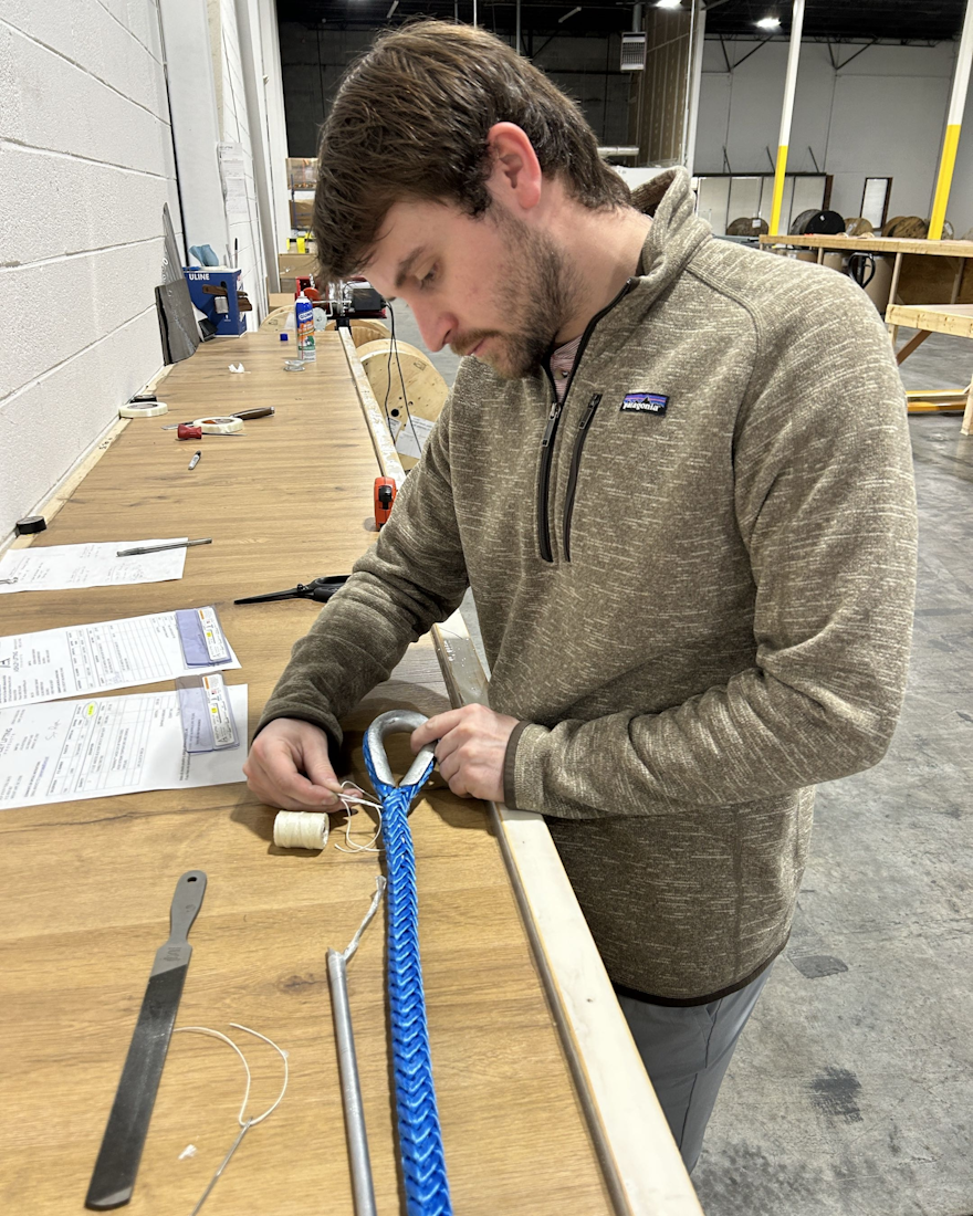J.A. Lifting Products employee fabricating a synthetic rope eye splice