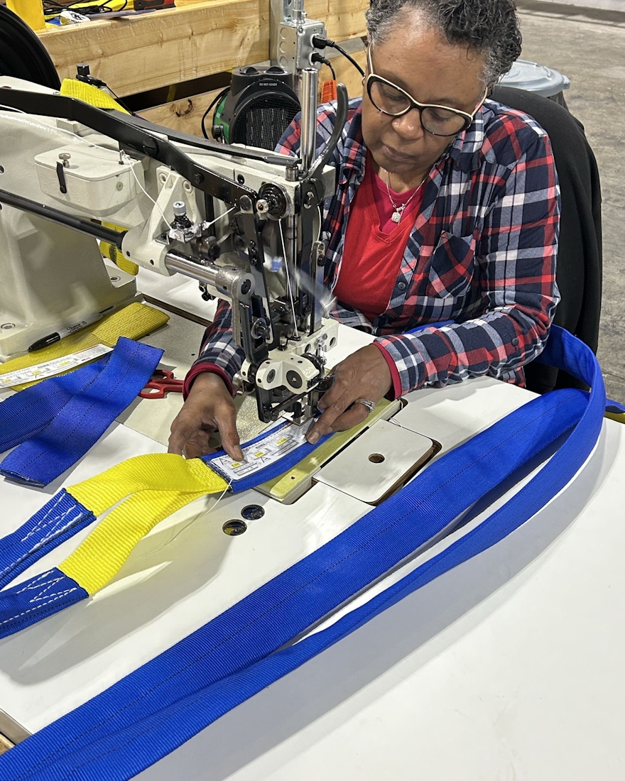 J.A. Lifting Products employee fabricating a web sling